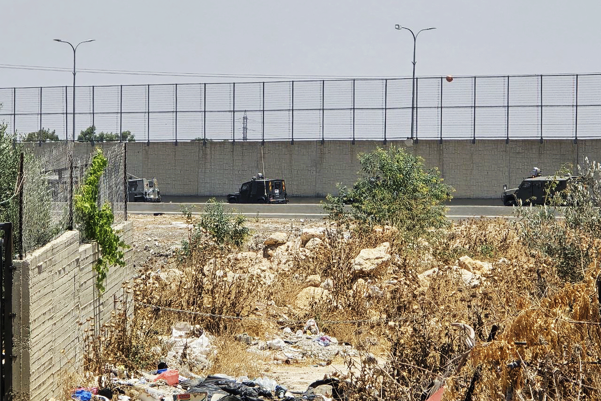 Two Palestinians Shot Near Jerusalem; Raids in West Bank